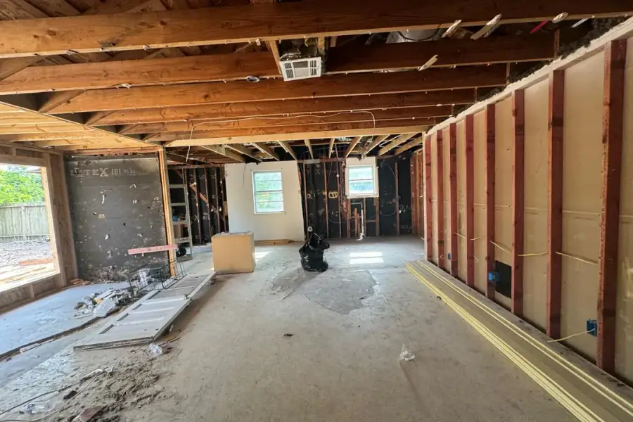 House interior taken back to the framing with the ceiling joists exposed