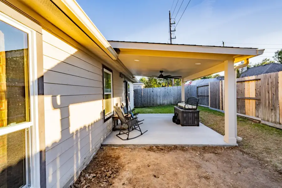 Finished covered patio at the back of a Houston home